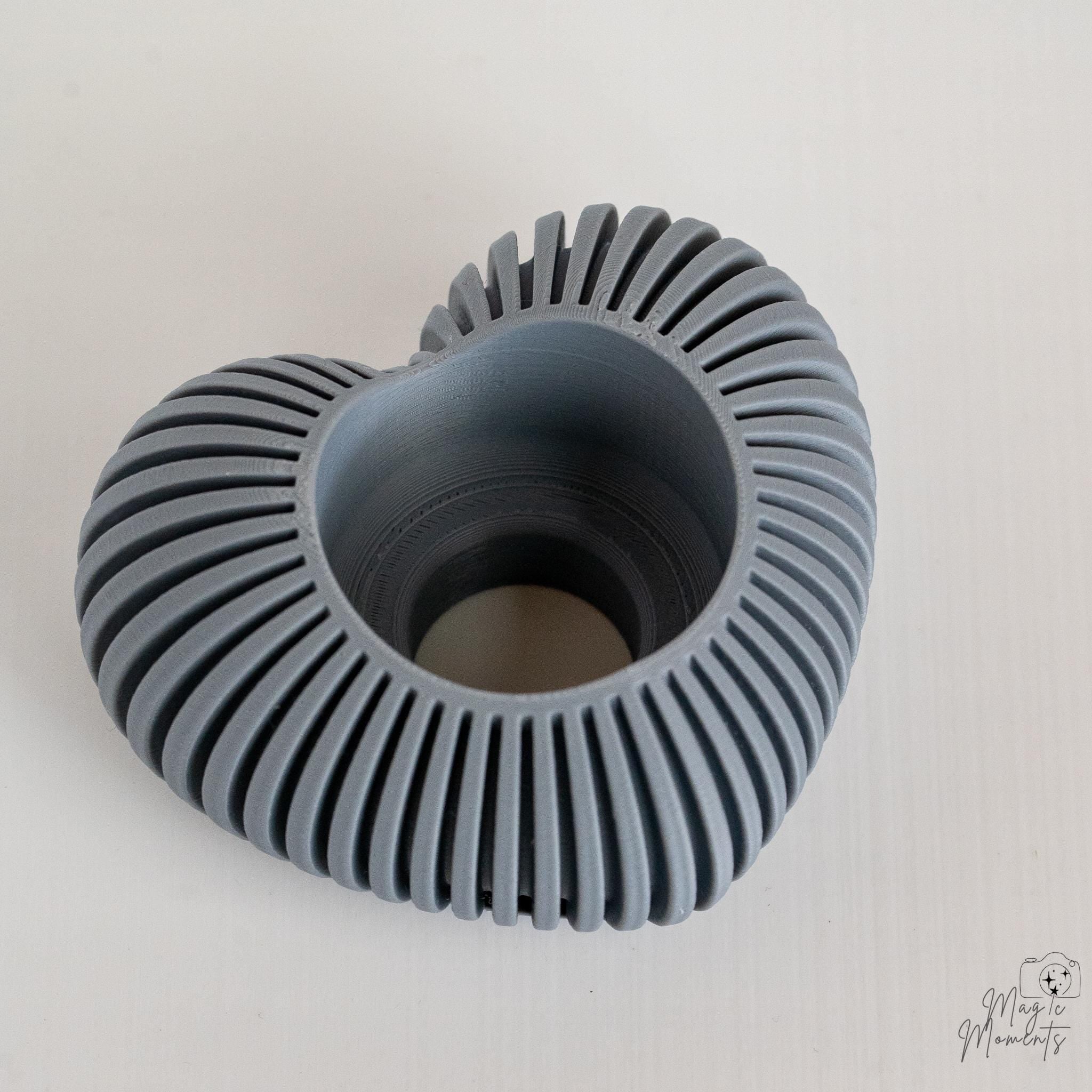 Grey heart candle holder top view showing spiral texture