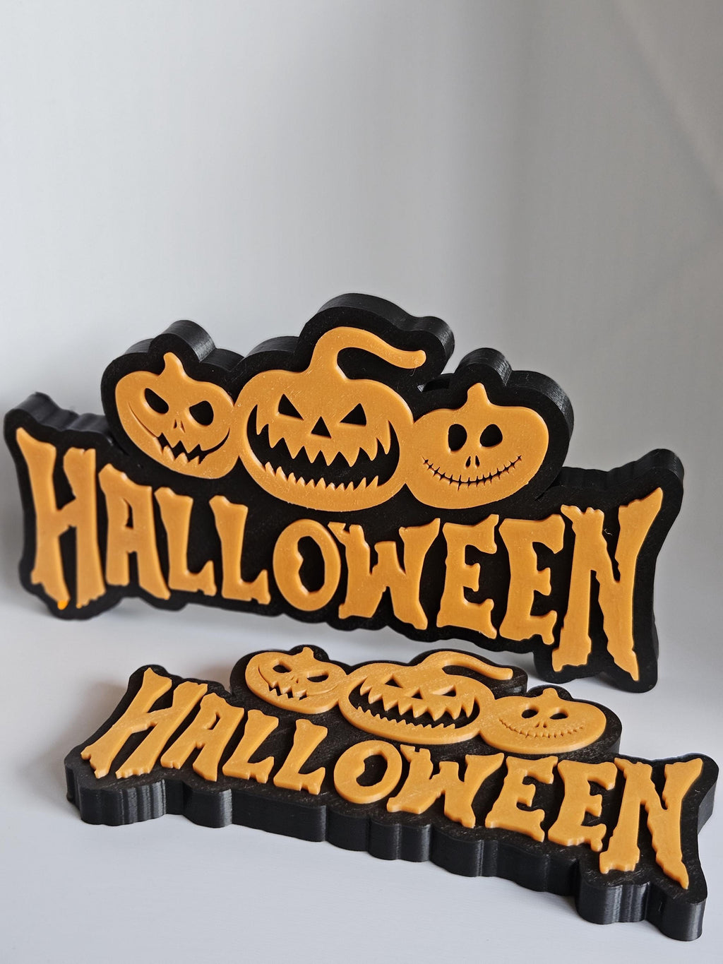 Halloween sign with pumpkin faces decoration