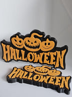 Halloween sign with pumpkin faces decoration