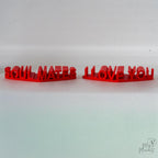 3D printed red heart decorations with modern ribbed texture pattern