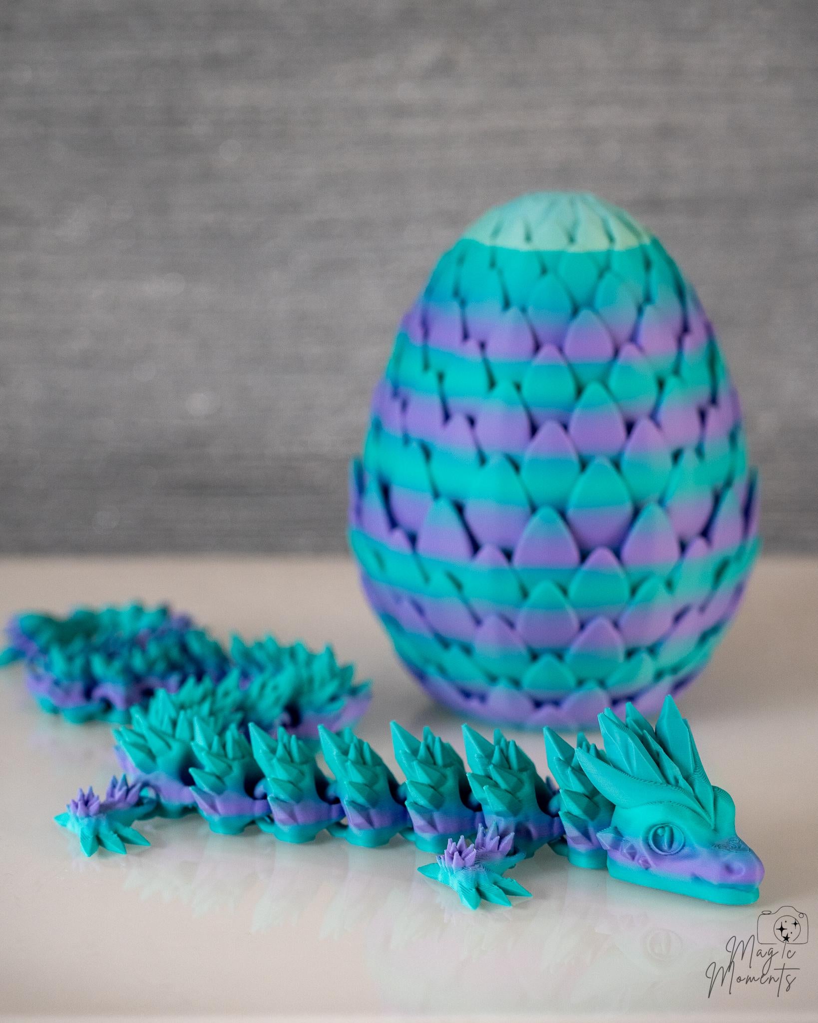 turquoise dragon egg with articulated dragon