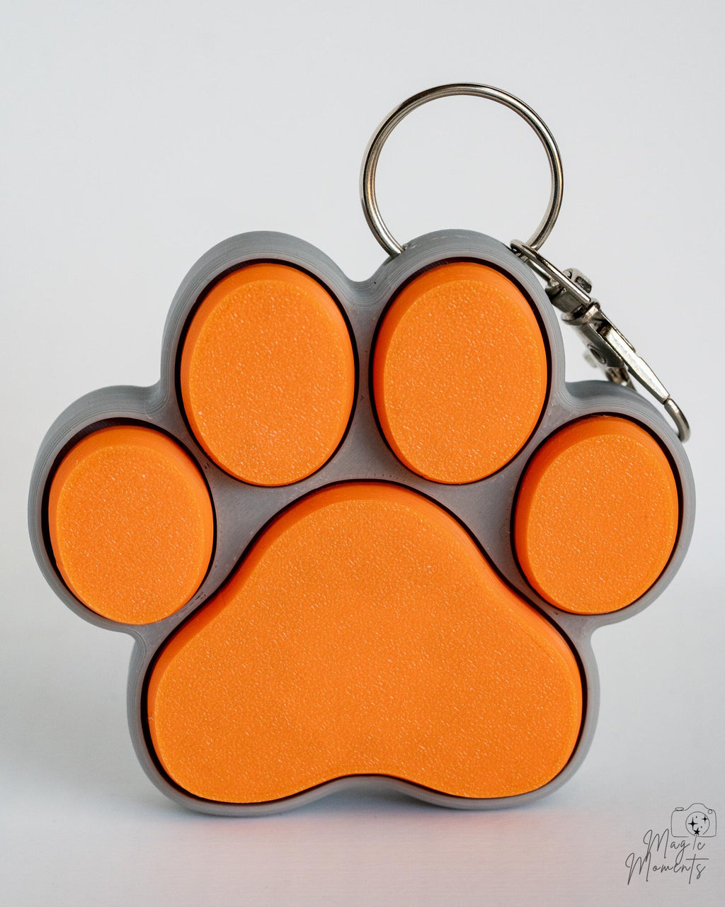 orange and grey paw clicker keychain