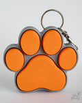 orange and grey paw clicker keychain