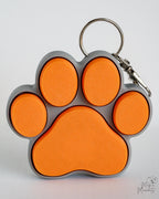 orange and grey paw clicker keychain