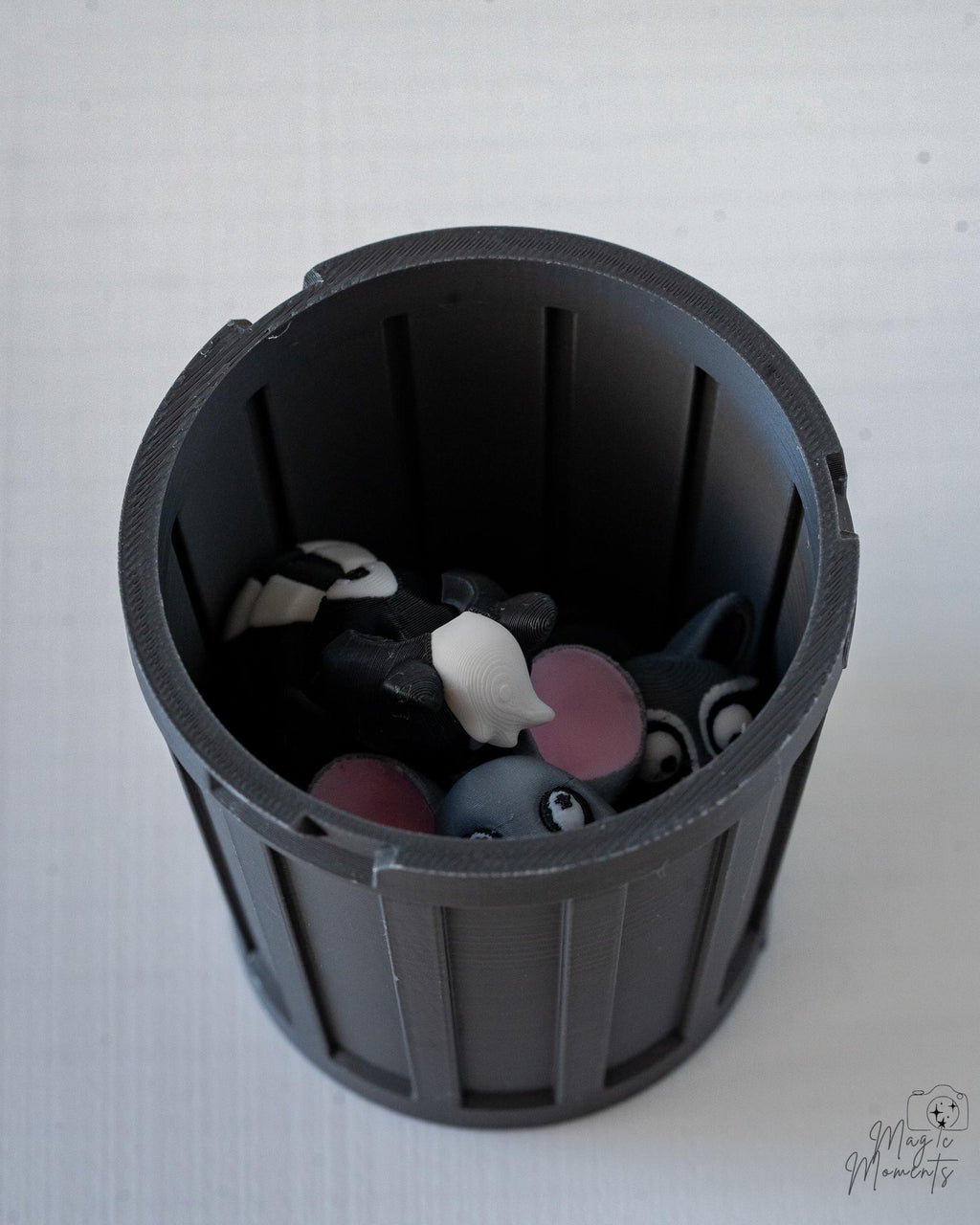 Black bin with small animal figurines
