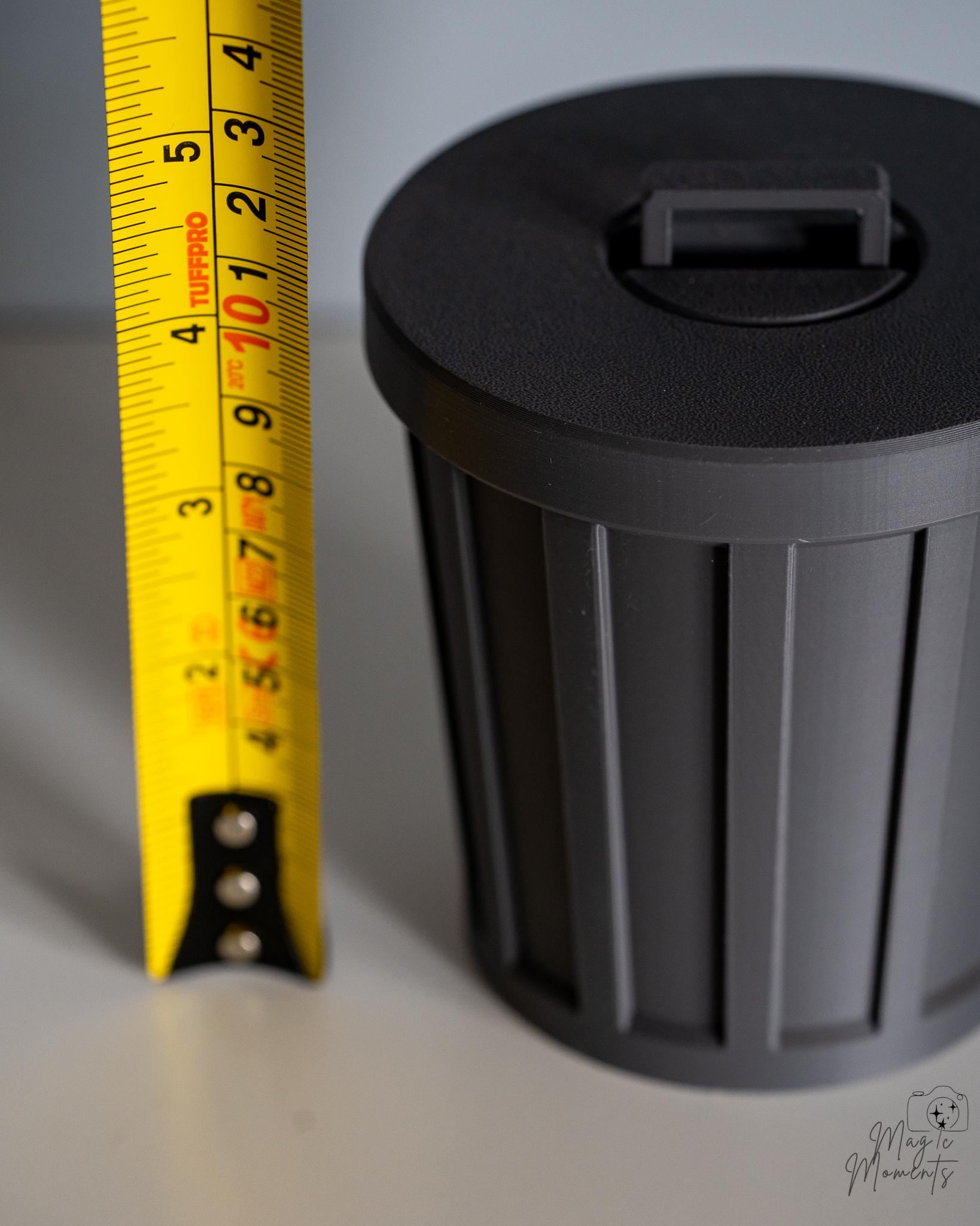 trash can storage container next to measuring tape for scale